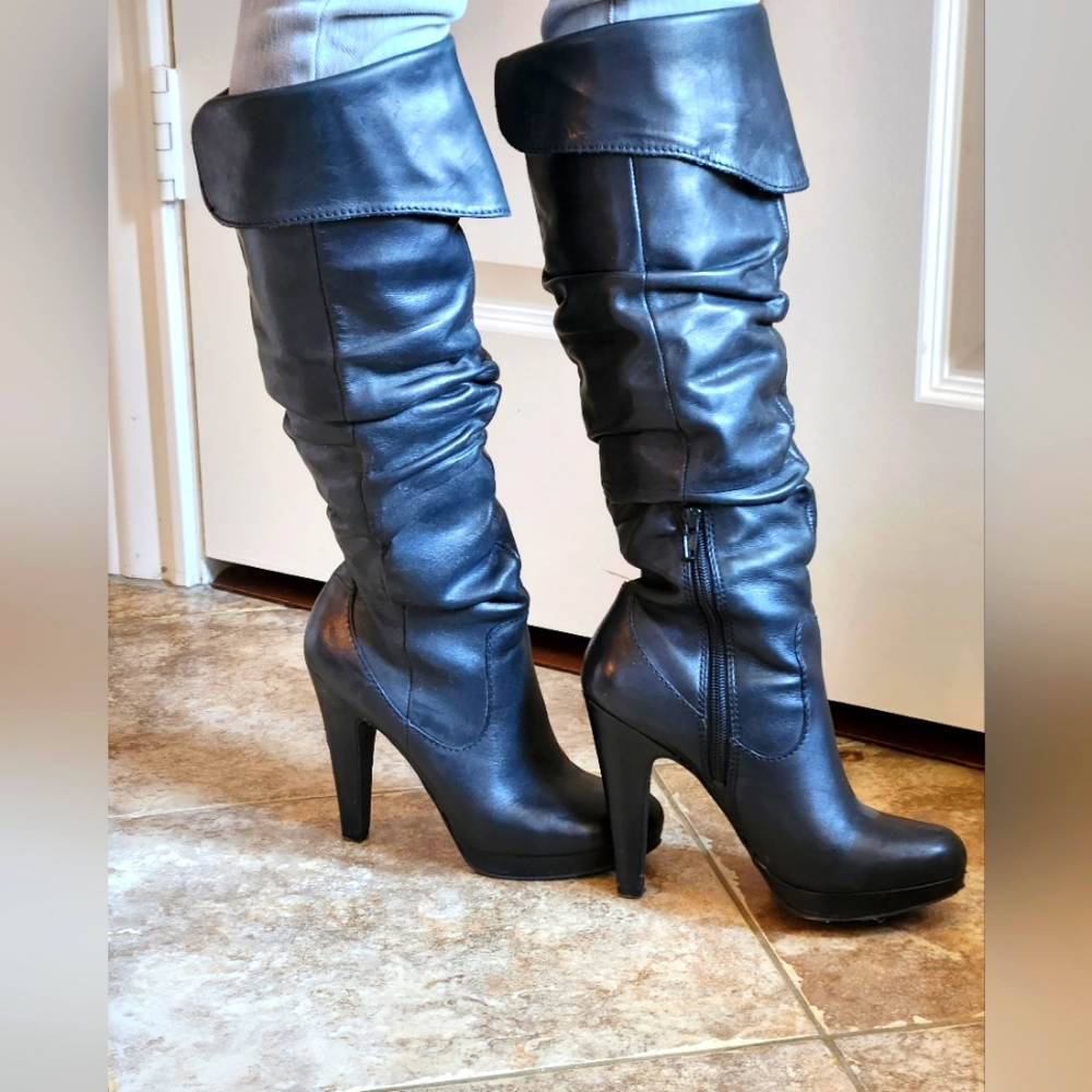 High-heel black leather boots